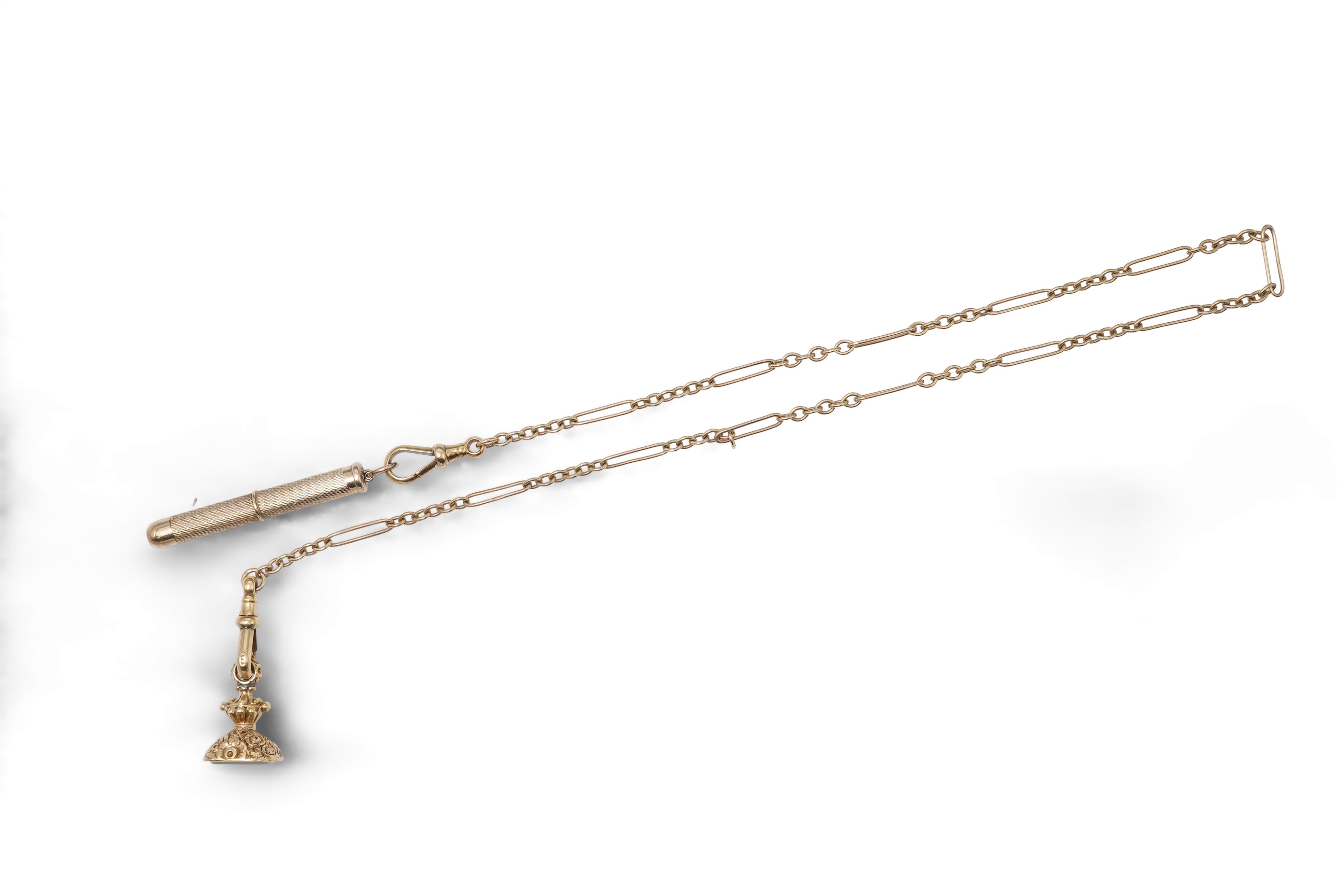 A gold watch chain, toothpick and fob seal